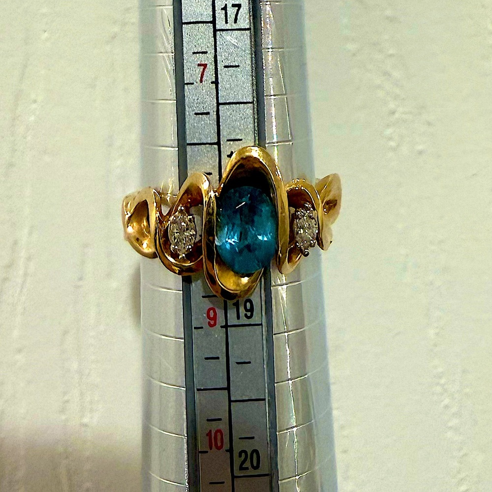 Blue Topaz and diamonds set in a unique Freeform gold band